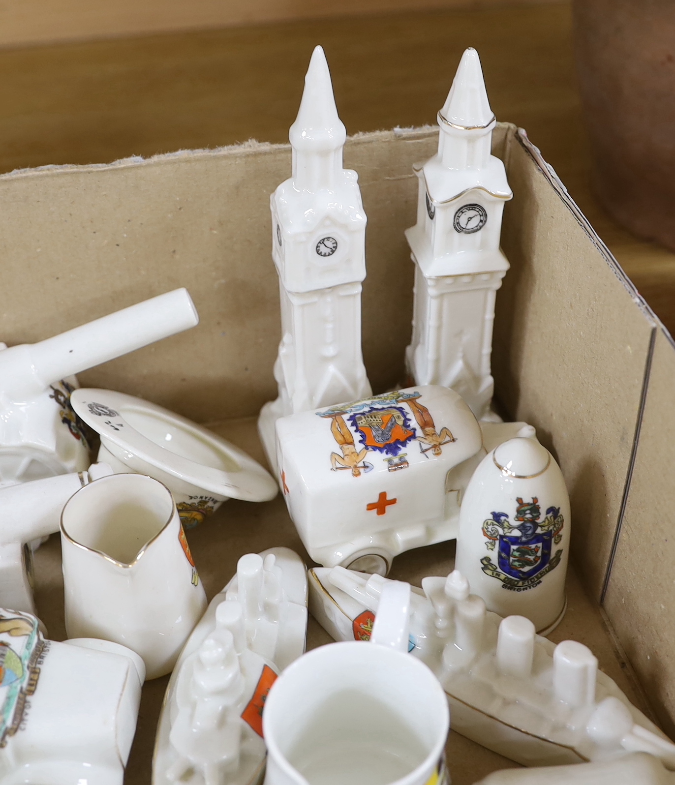 A collection of heraldic miniature crested china including W H Goss and Swan, the largest each 16.5cm high